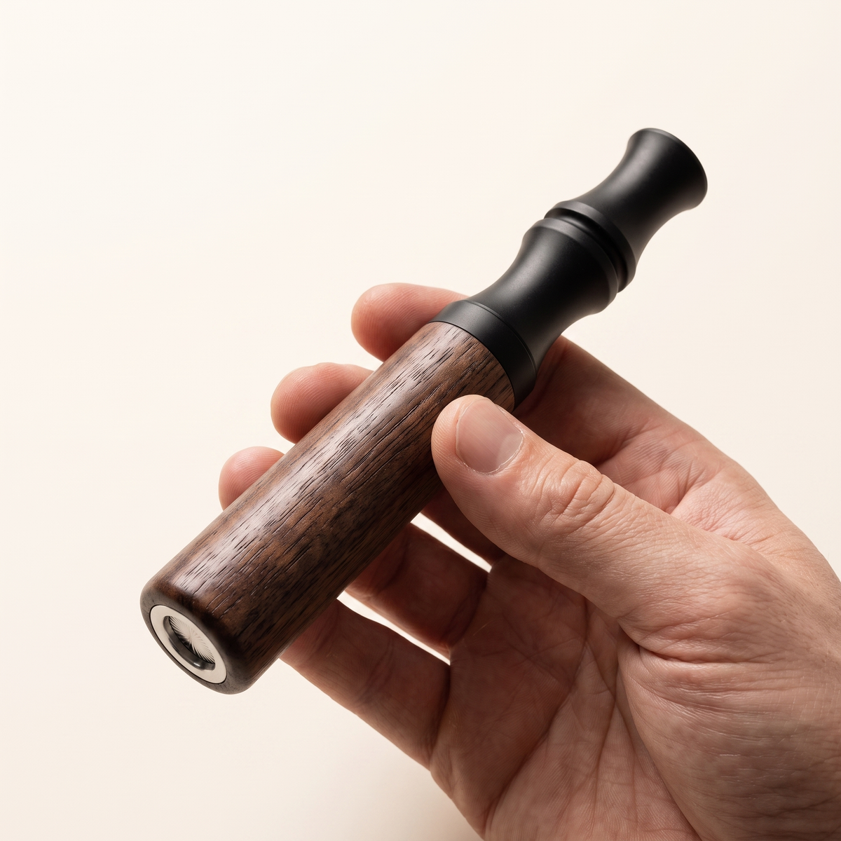 Actual scale — the Hale device held in one hand