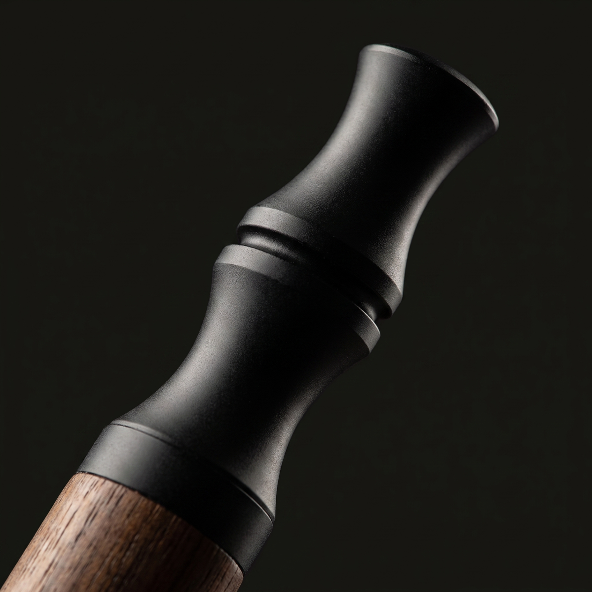 Macro detail of the matte black mouthpiece